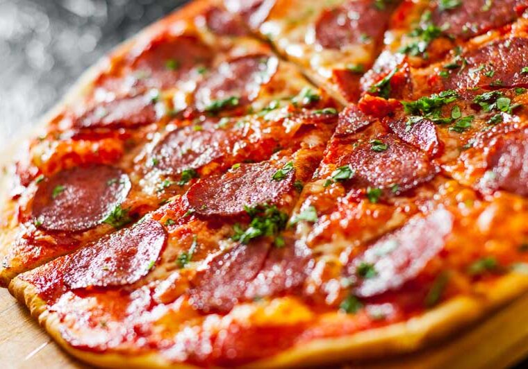 sliced Pepperoni Pizza with Mozzarella cheese, salami, Tomatoes,